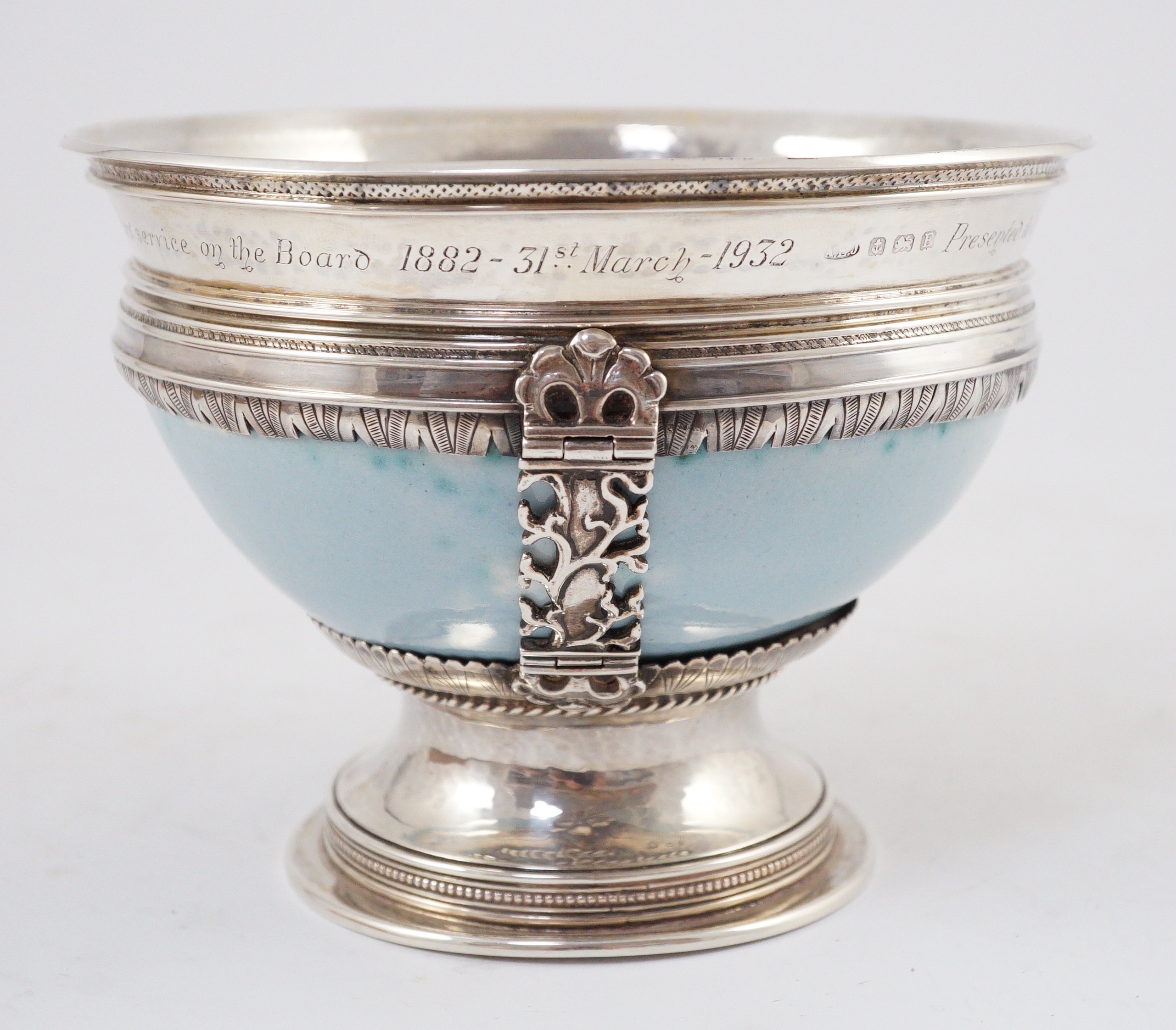 An Arts and Crafts silver mounted Ruskin pottery pedestal bowl, the silver mounts by A.E. Jones, Birmingham 1929, 16.5cm diameter